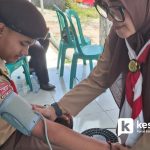 Pemeriksaan Tekanan Darah Pramuka oleh Tim Kesehatan Puskesmas Singaparna